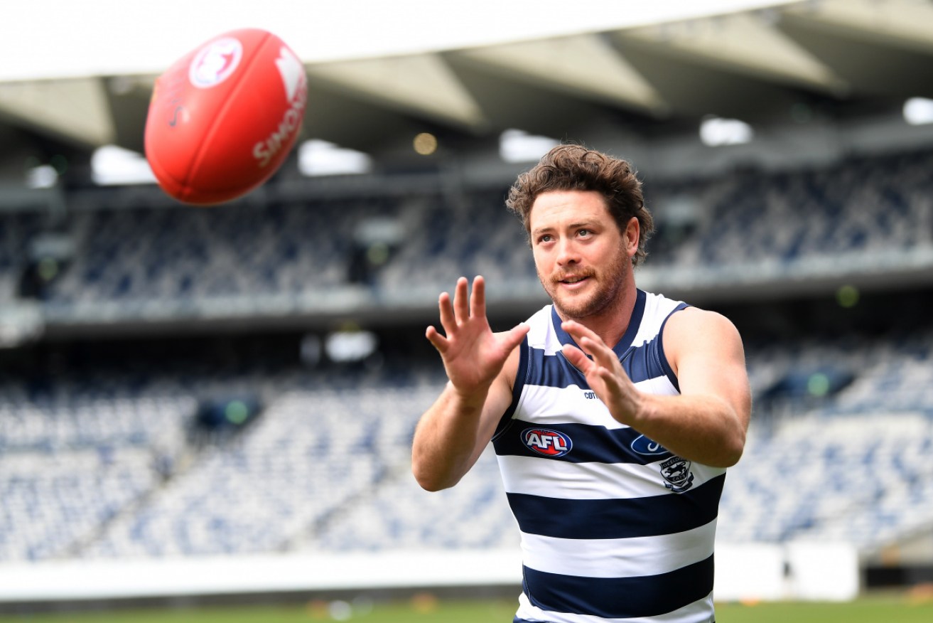 The Geelong midfielder arrived at club HQ for training on Monday after recovering from a mysterious stab wound that required surgery.