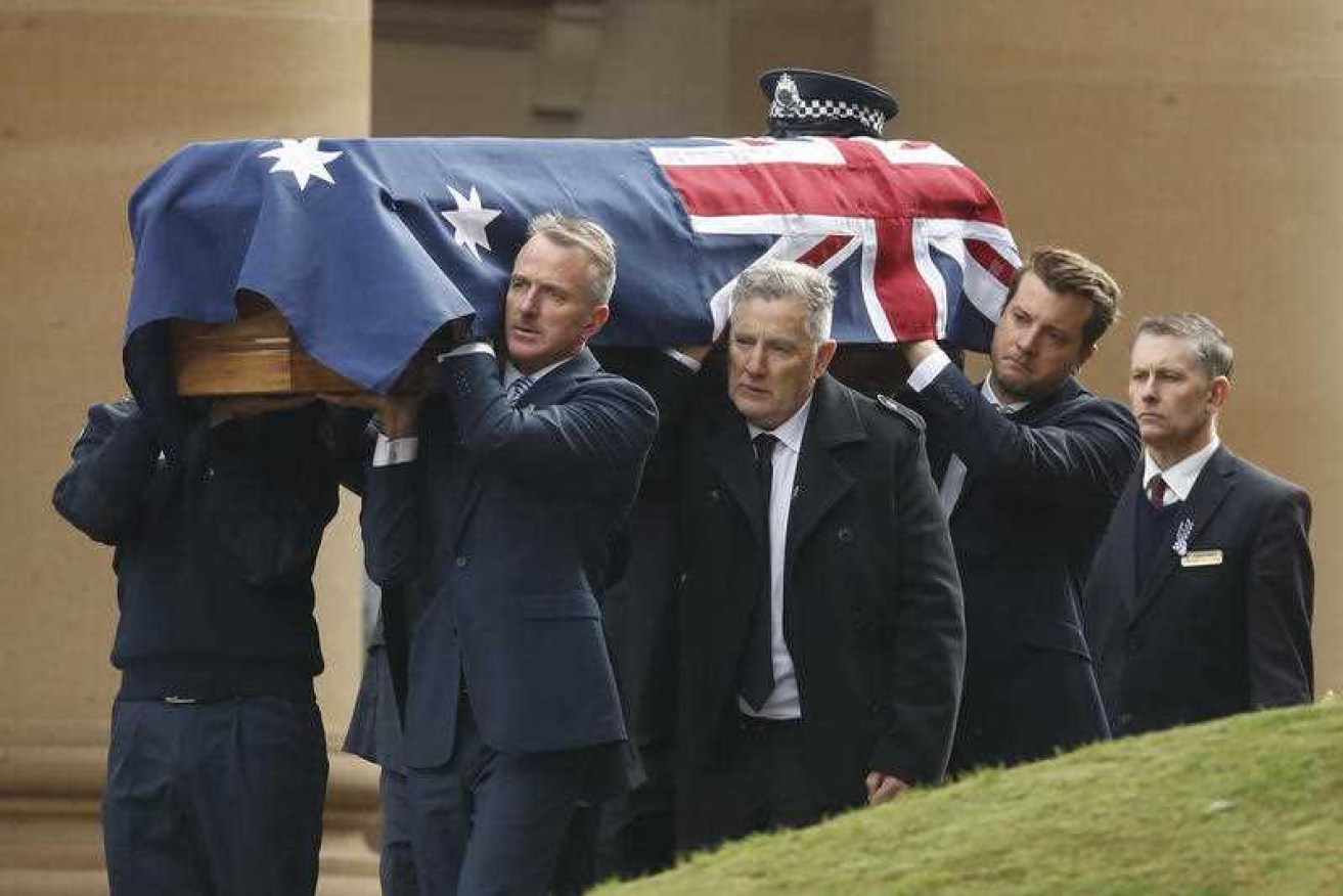 The coffin of Constable Josh Prestney is carried at Xavier College in Melbourne.
