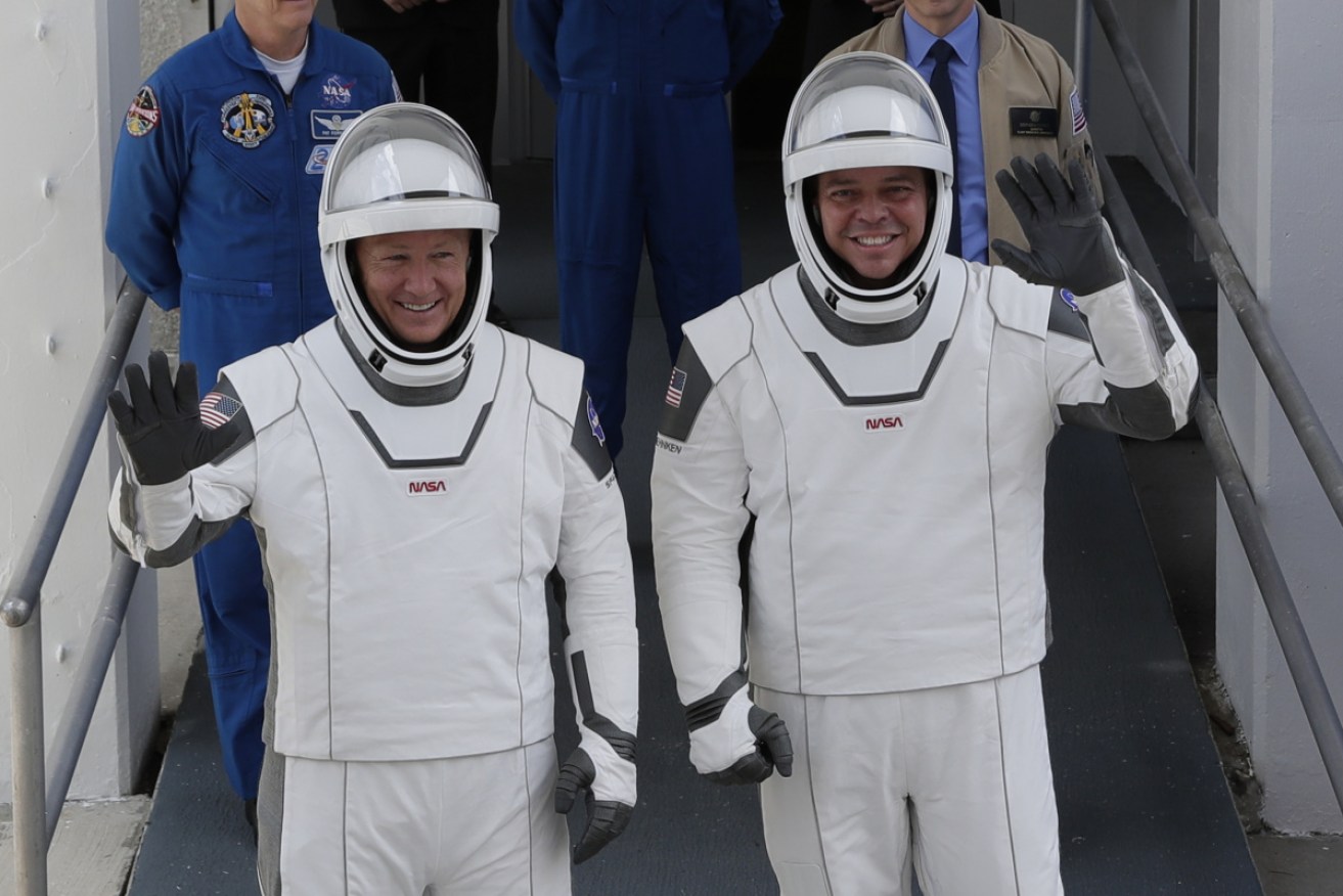 NASA astronauts Douglas Hurley, left, and Robert Behnken on their way to Pad 39-A, at the Kennedy Space Center.