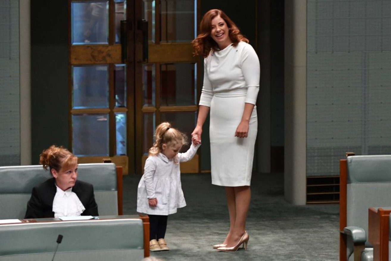 Anika Wells, pictured with her daughter, thinks it's time to shake up how we work. 