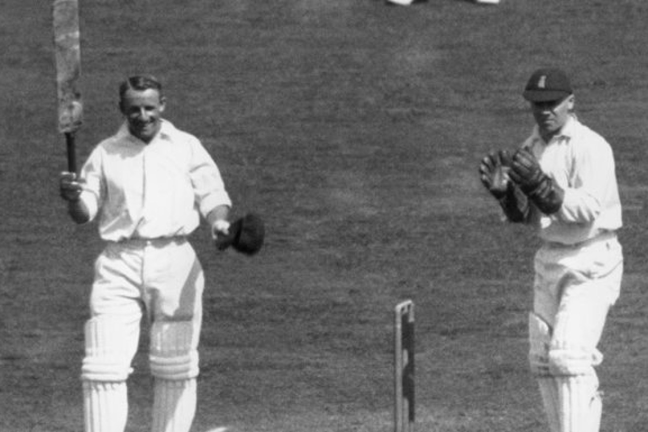 Australian cricketing legend Don Bradman saluting the crowd during the 1930 Ashes. 