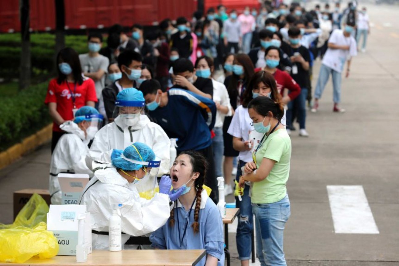 People being tested in Wuhan. The motion does not specifically mention where the outbreak is believed to have begun.
