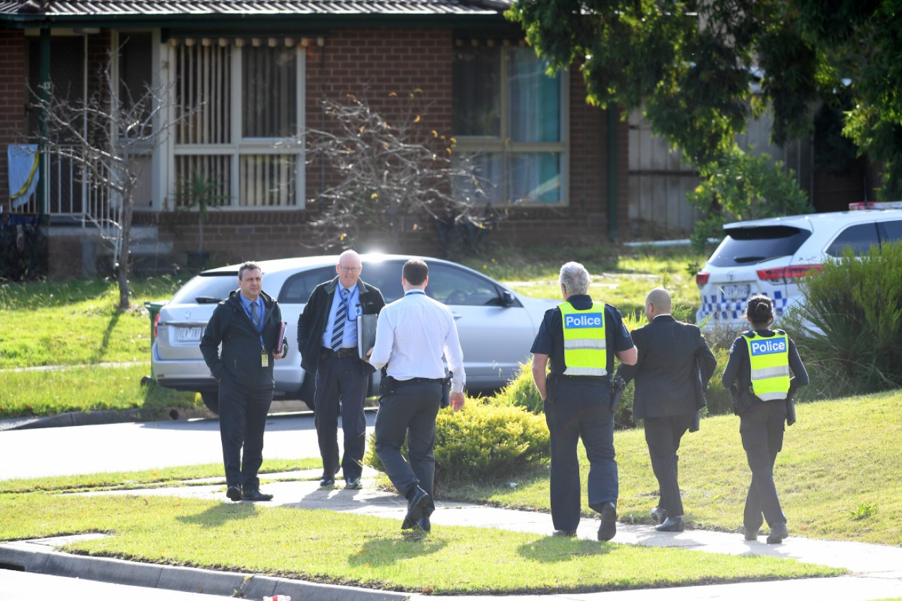 Victoria Police officers and detectives near a crime scene in Endeavour Hills, Melbourne on Tuesday.