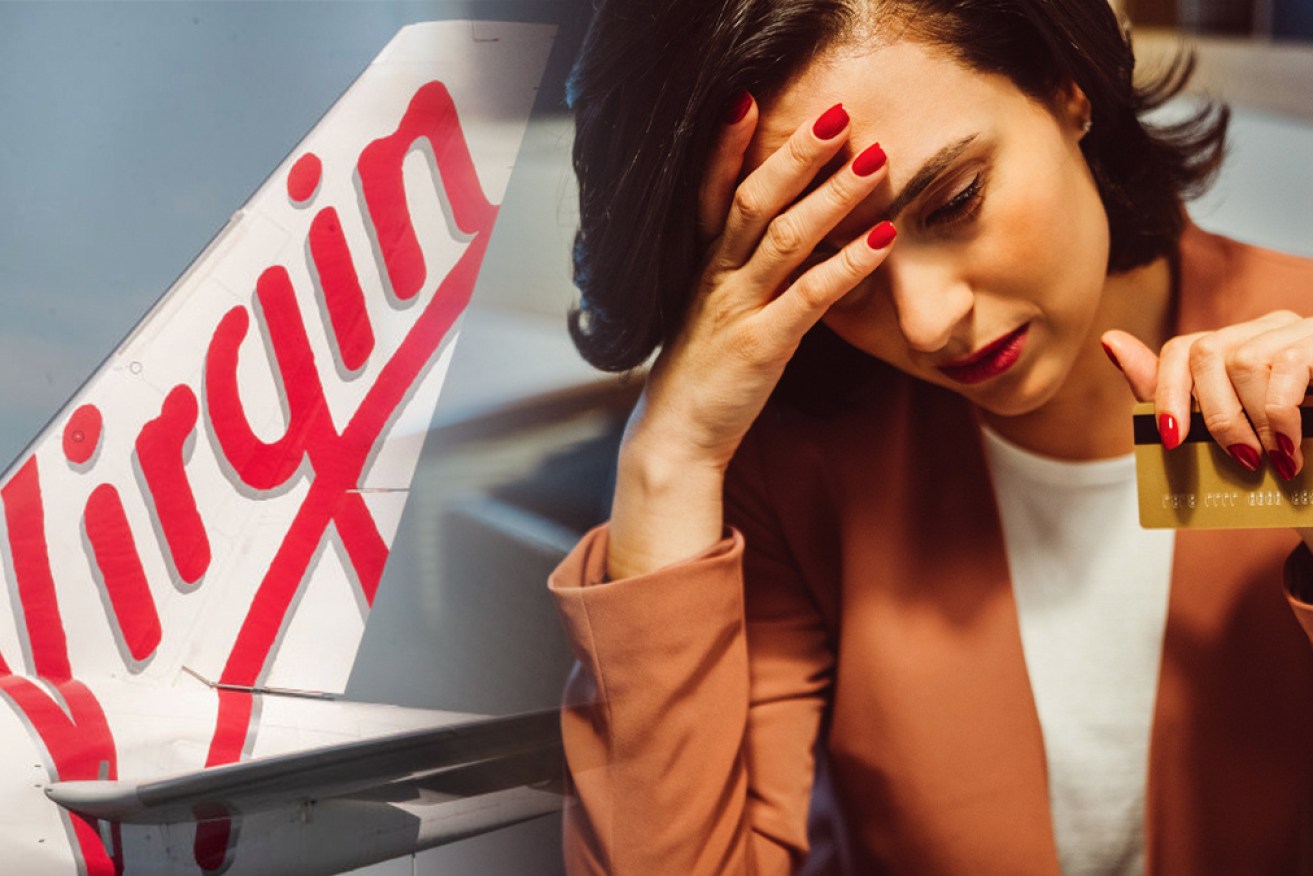 Major banks have been slammed for charging sky-high interest rates on credit cards tied to Virgin's frequent flyer program.
