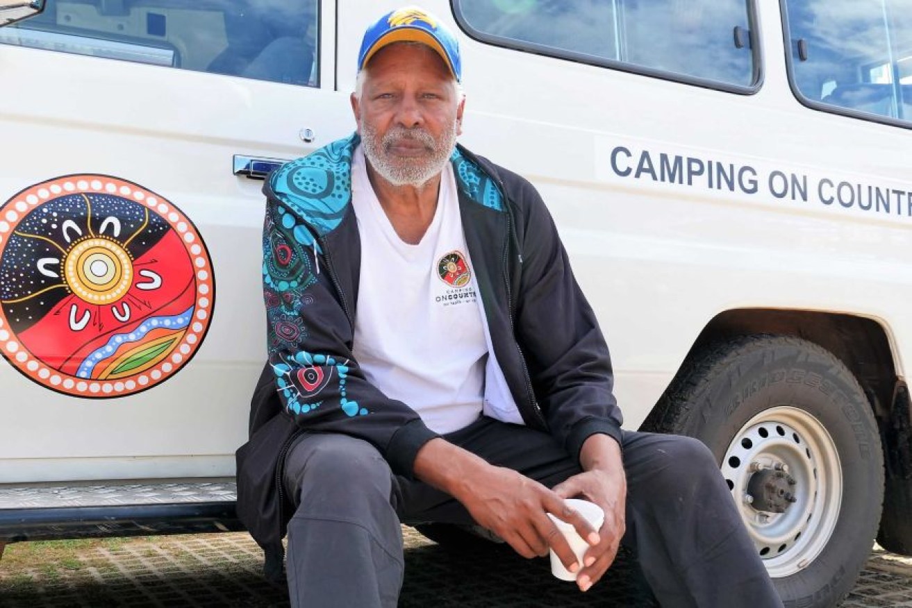 TV personality Ernie Dingo said he hit a man after an alleged racist slur at a Perth train station.