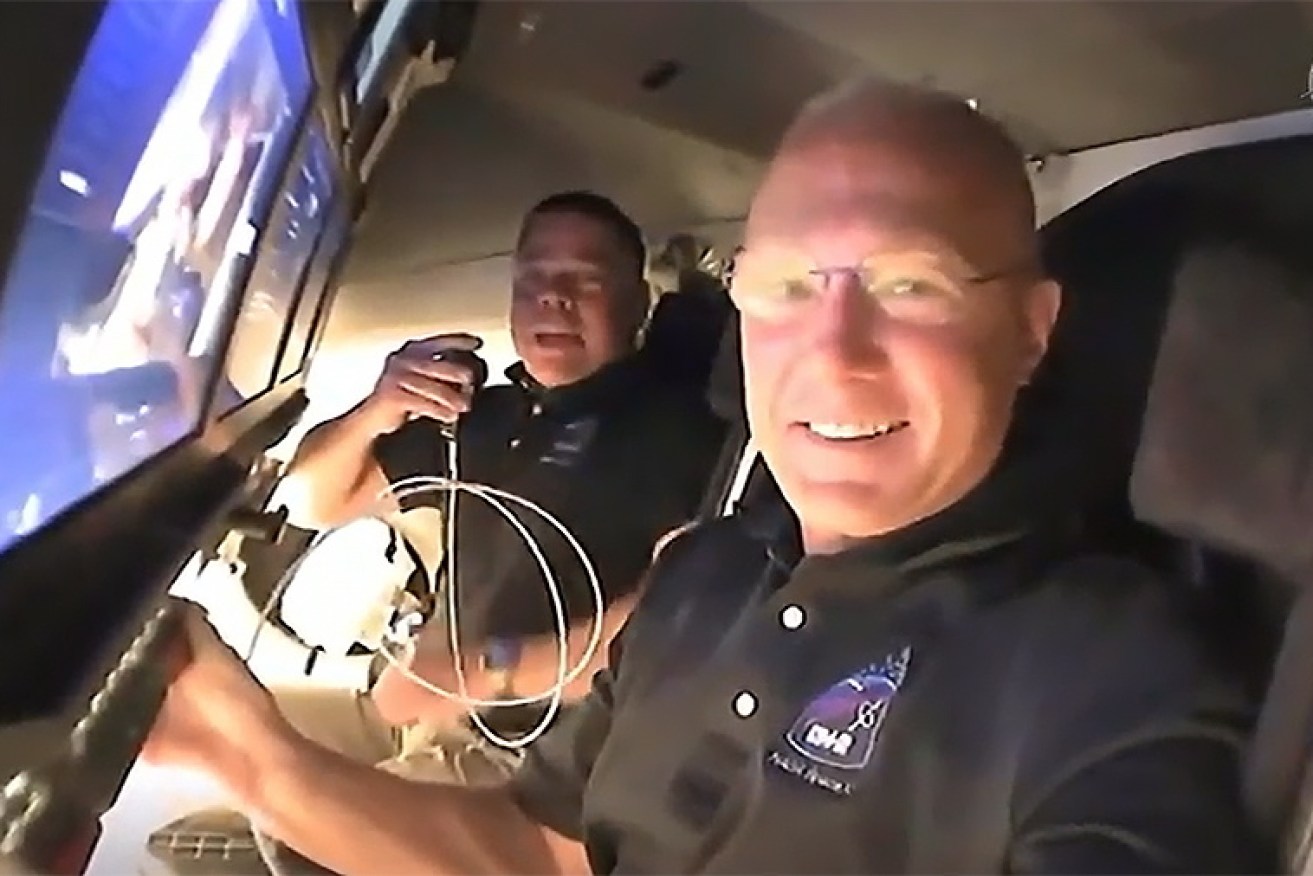 NASA astronauts Doug Hurley (foreground) and Bob Behnken are on their way home 
