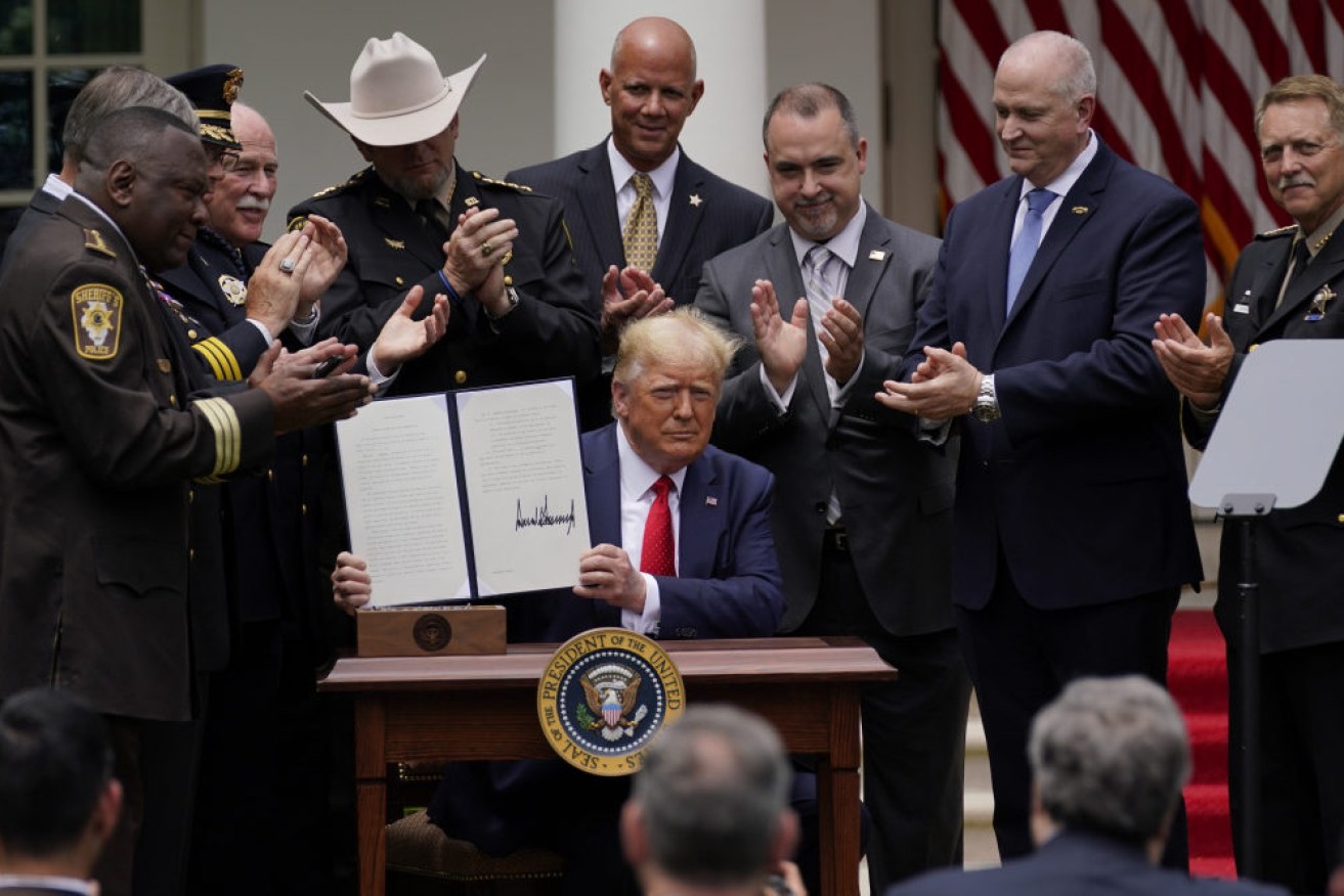 President Donald Trump signed the order in the White House Rose Garden.