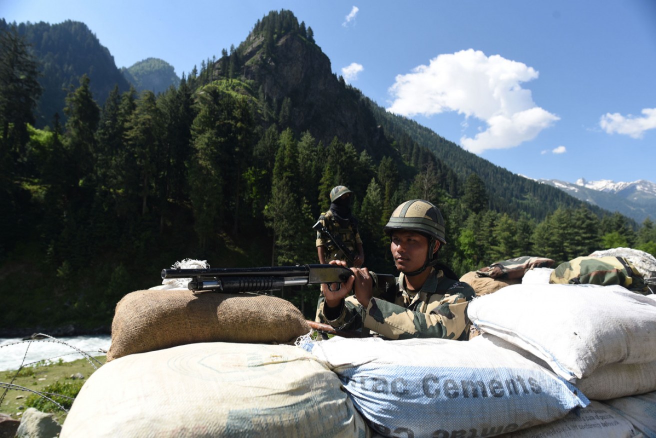 Indian army personnel man a checkpoint along a highway leading to the disputed region.