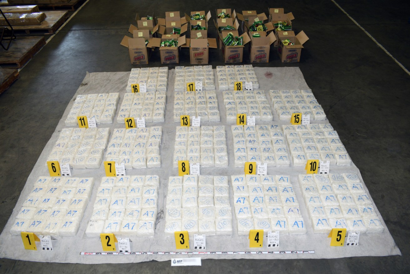 Three men have been charged over 360kg of crystal methamphetamine hidden in a container of furniture.