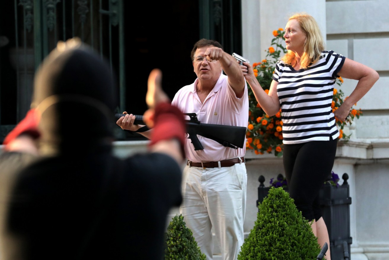 Mark and Patricia McCloskey confronted  protesters with guns. 