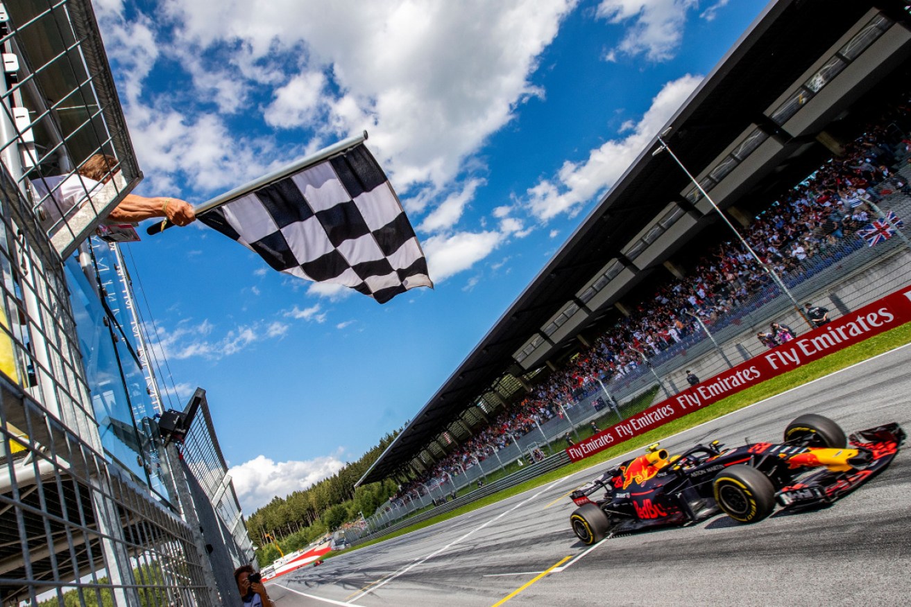 Max Verstappen takes the checkered flag in 2018 at the Spielberg circuit where racing will resume.