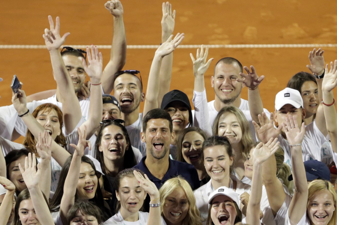 Novak Djokovic, posing  with volunteers at the Adria Tour tournament in Belgrade on June 14, has tested positive for coronavirus. 