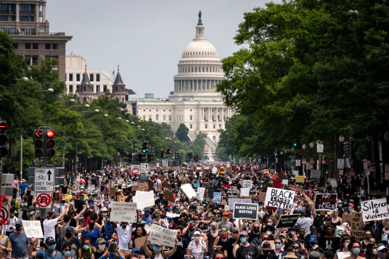 Demonstrators march down Pennsylvania Avenue in Washington, DC on day 12 of outrage over the death of George Floyd. Photo: Getty