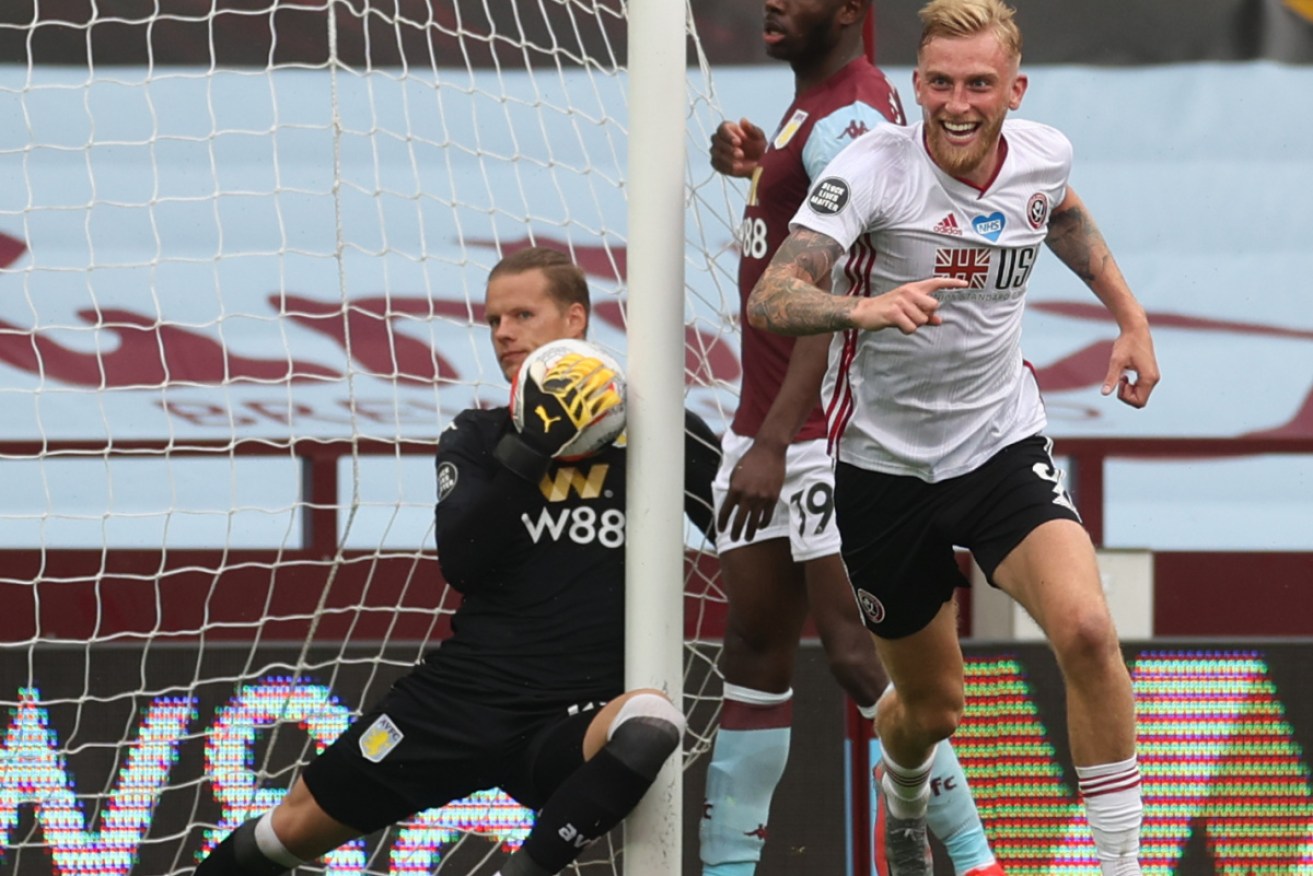 Sheffield United Oliver McBurnie wheels away in delight after Oliver Norwood's free-kick crossed the line - he was to be disappointed.