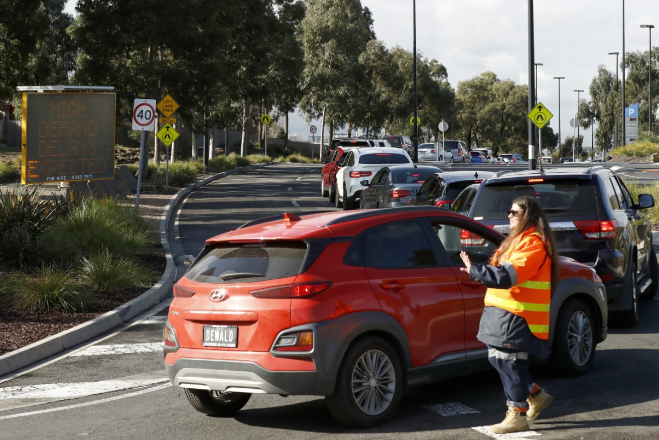 Drivers queued for hours at Melbourne's Highpoint Shopping Centre for COVID tests on Tuesday.