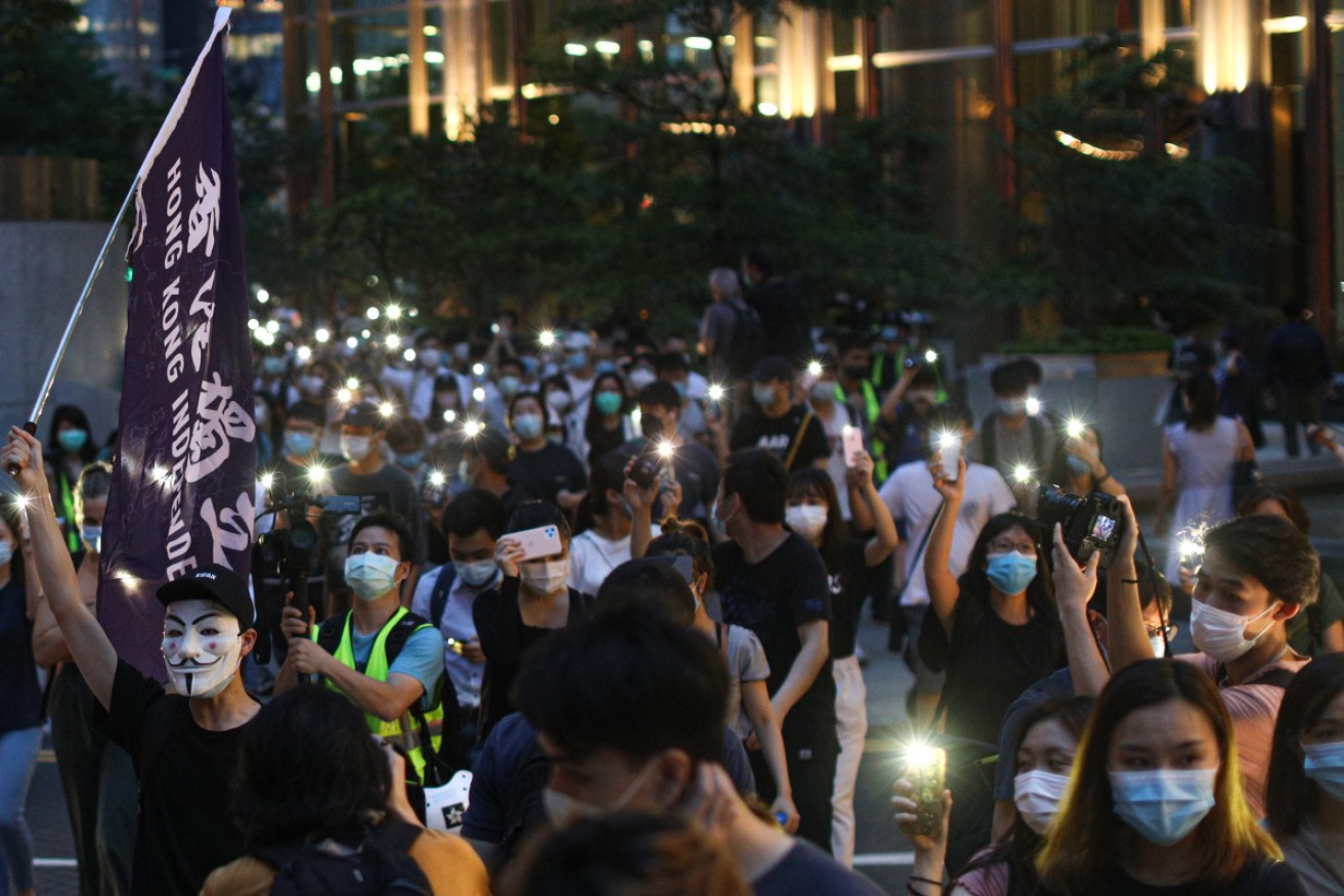 Activists rally on Tuesday to mark the anniversary since a million people marched against the now-scrapped extradition bill in Hong Kong. 