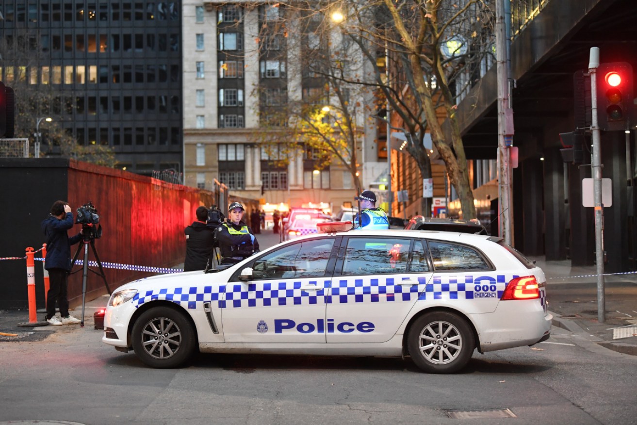 Victoria Police officers block off Market Street in Melbourne on Monday.