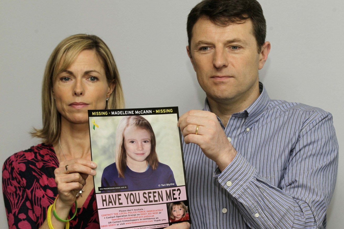 Kate and Gerry McCann in May 2012  show a computer-generated image of Madeleine. 