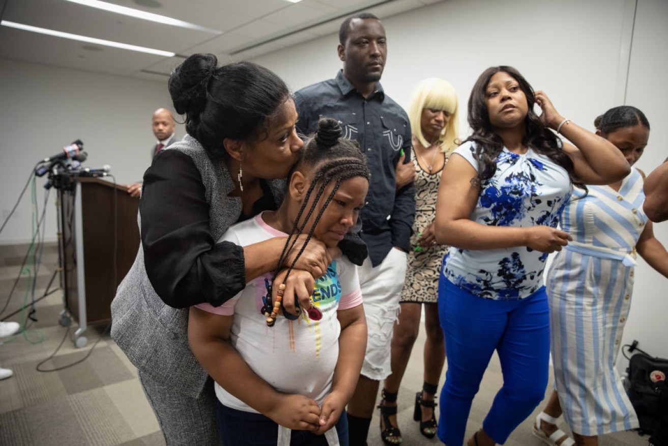 Rayshard Brooks' daughter Blessing, 8, leaves a press conference in tears after other family members addressed the fatal shooting by police in Atlanta. 