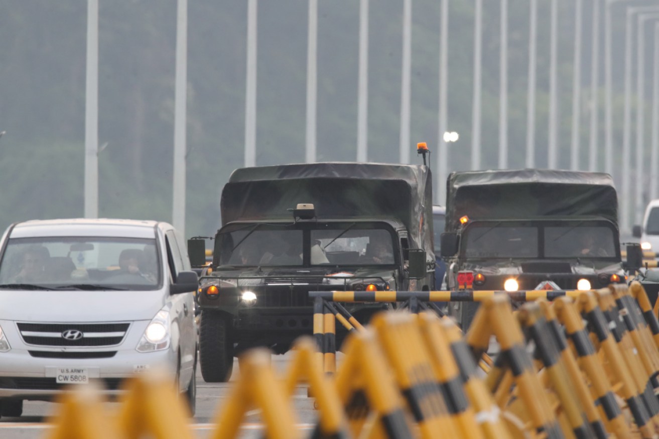 US military vehicles cross the Unification Bridge, after North Korea blew up the inter-Korean liaison office in North Korea's Kaesong Industrial Complex on Tuesday.