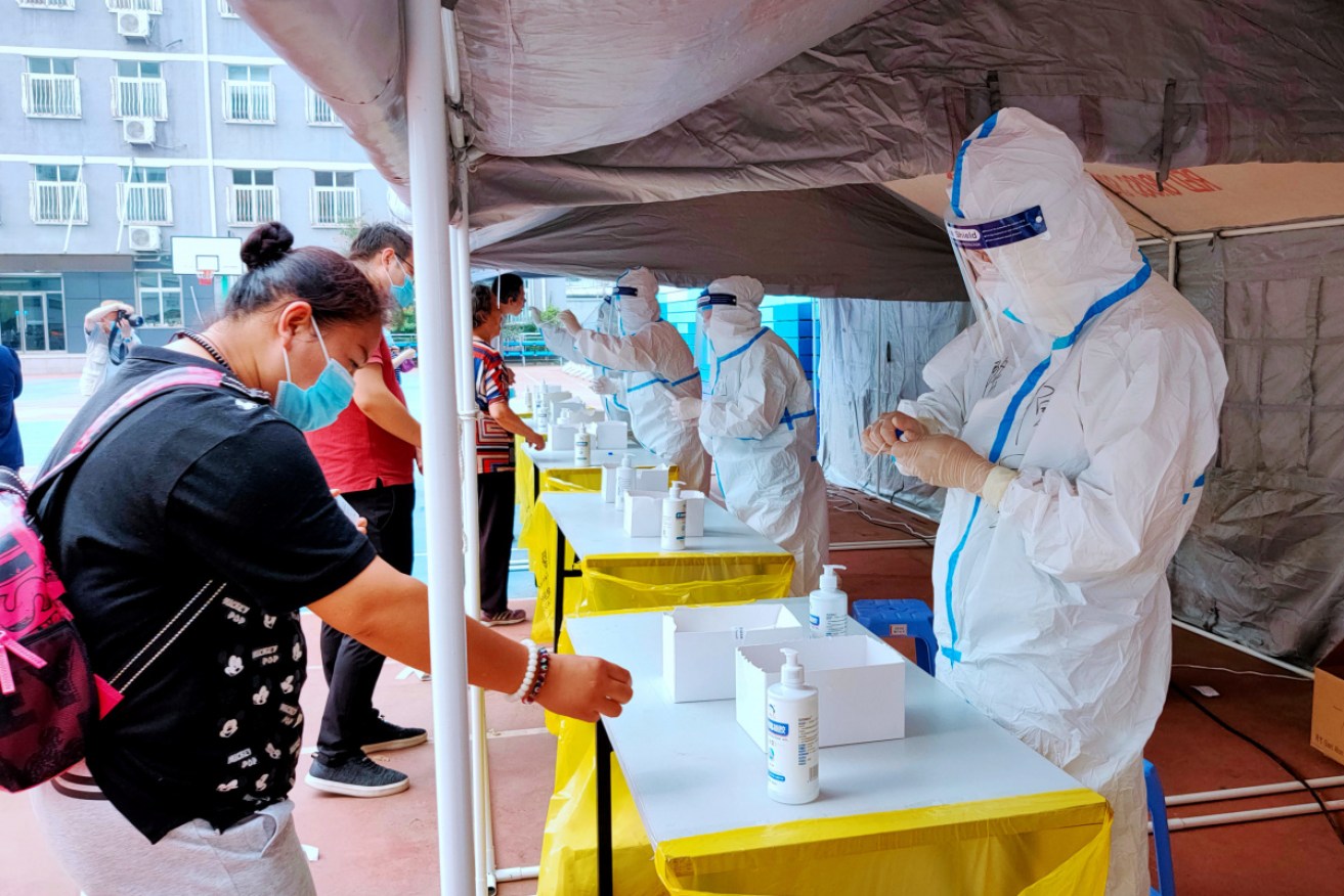 Citizens are tested for coronavirus at nucleic acid testing sites in Beijing, China, on Tuesday. 