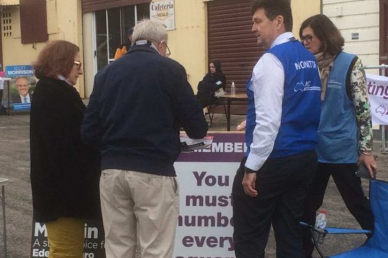 An AEC official speaks to Sheena Boughen about the offending sign.