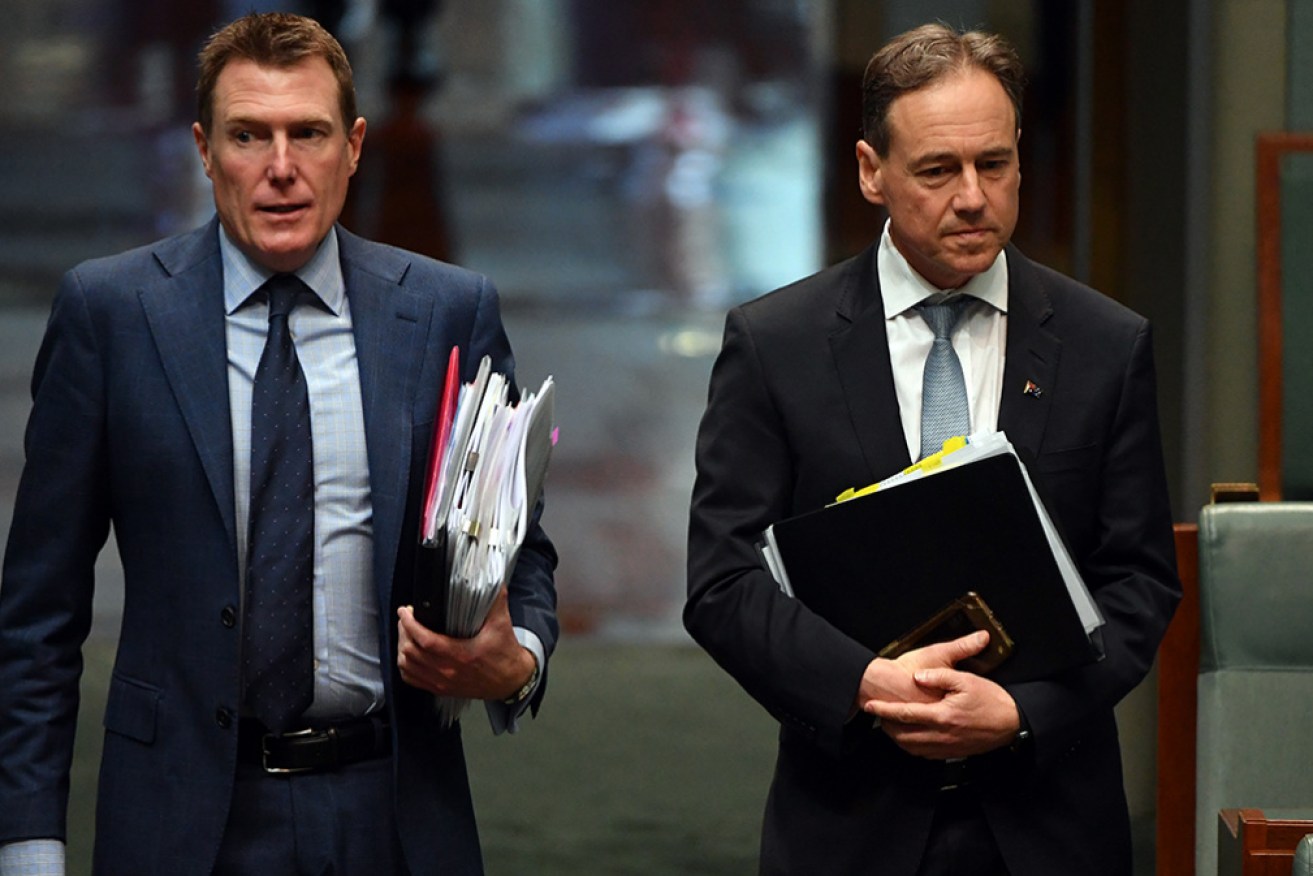 Attorney-General Christian Porter, with Health Minister Greg Hunt on Monday, says he is "totally committed" to the reform.
