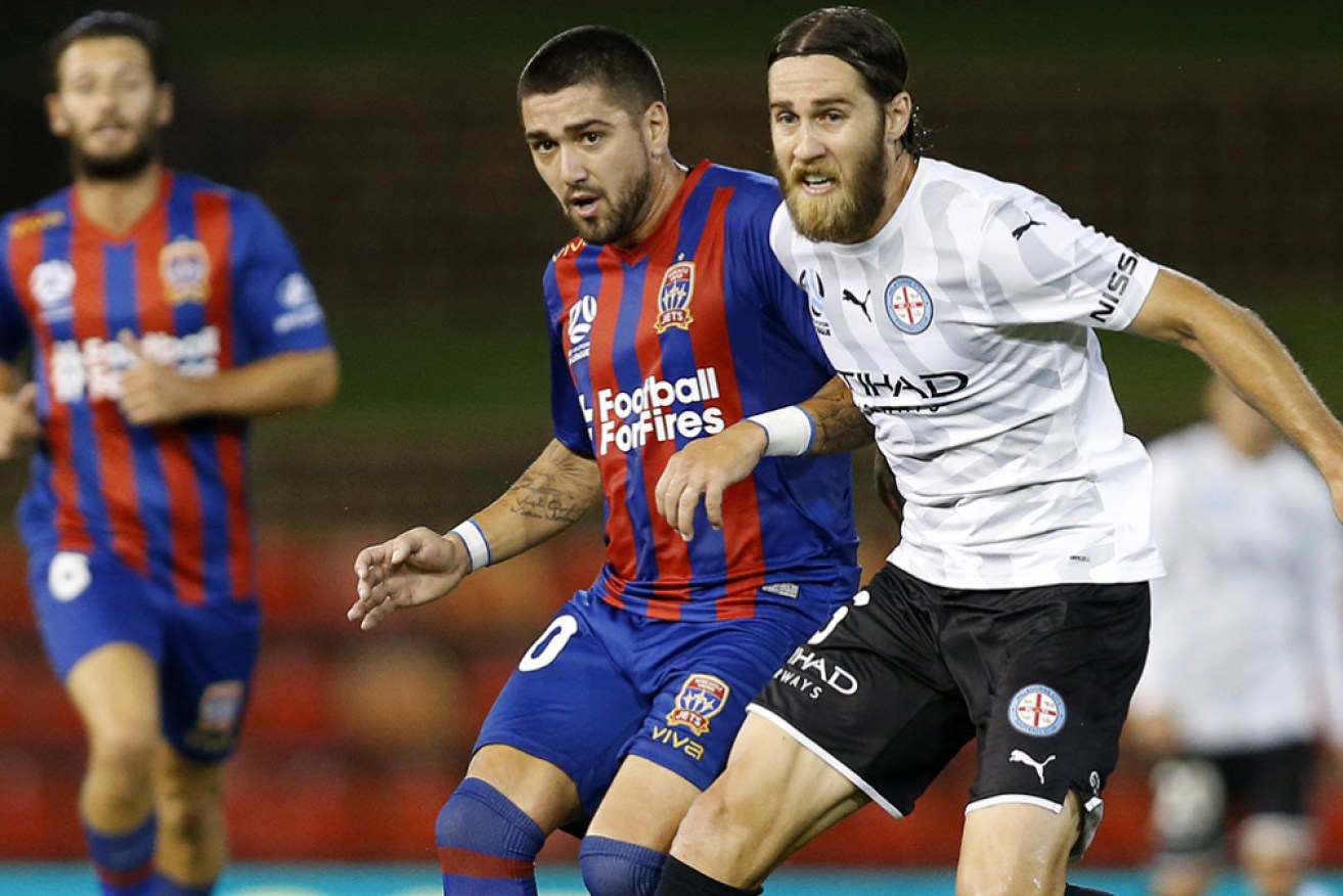 Newcastle’s Dimi Petratos and Melbourne City’s Josh Brillante in A-League action in March.