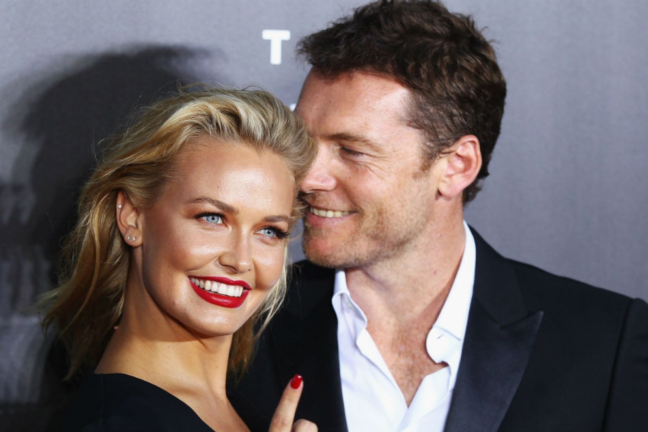 Lara and Sam Worthington have been papped with their newly born third child, but are keeping him under wraps.