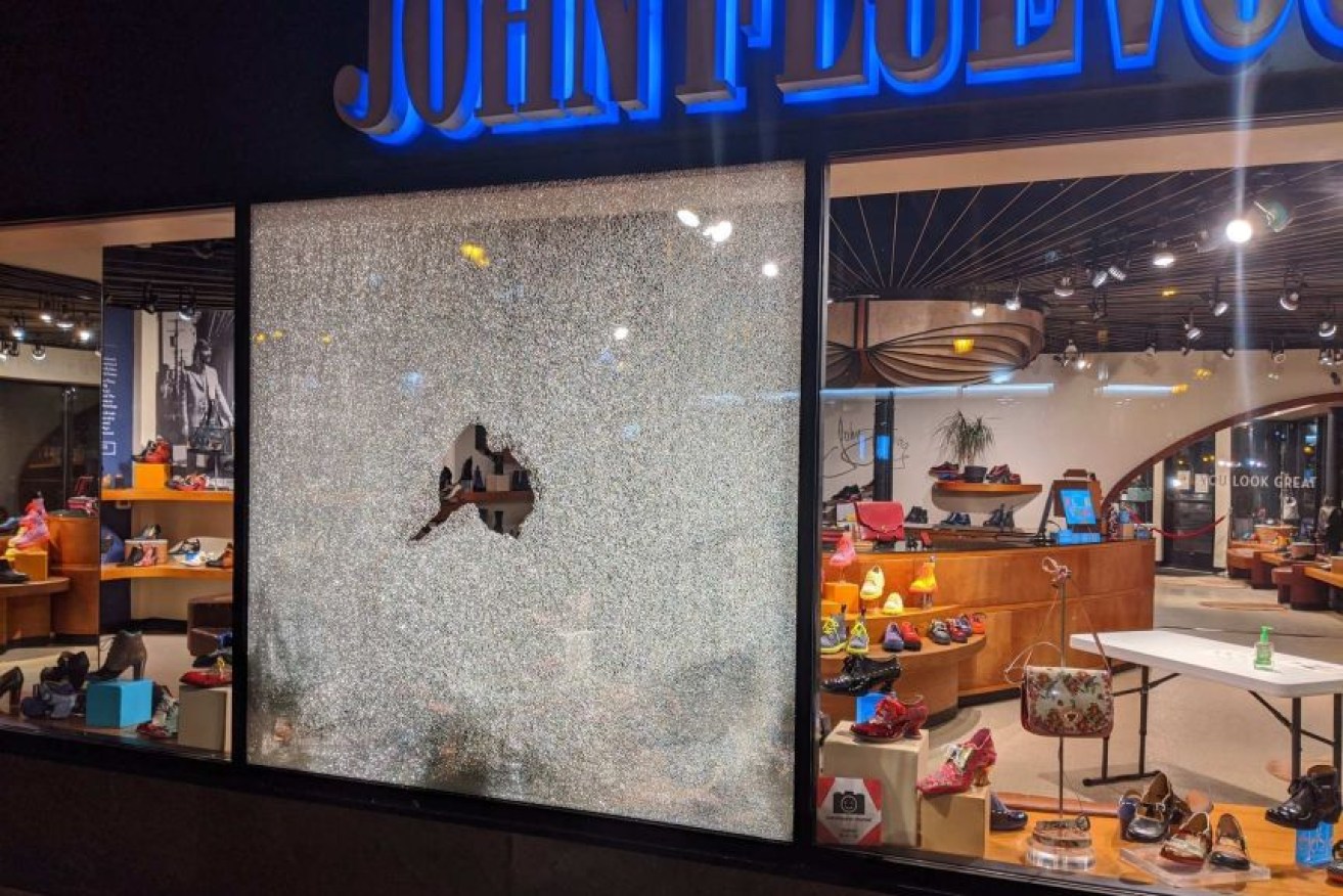 Photographs posted to social media showed damaged shop windows near where the shooting happened.
