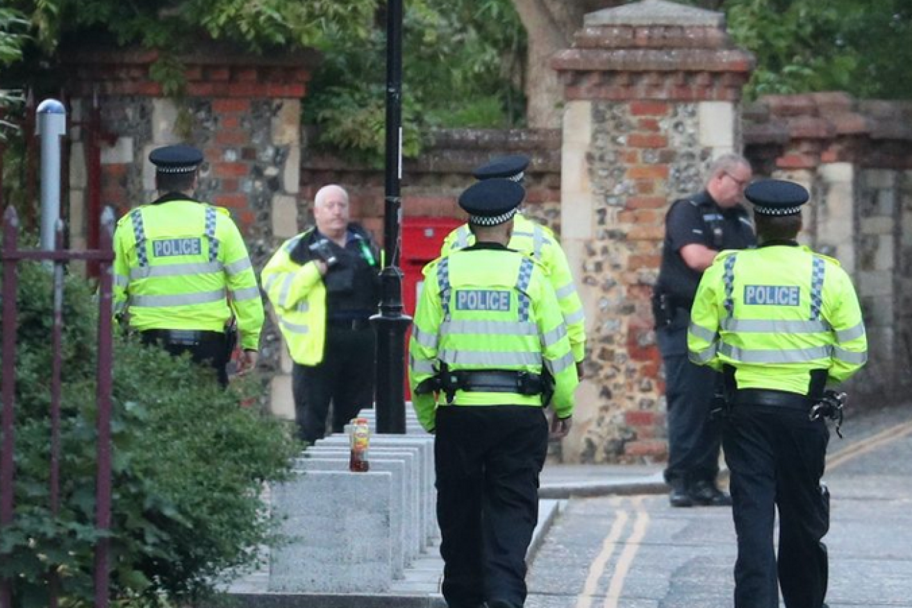Police converge on the scene of the grisly attack in Reading.