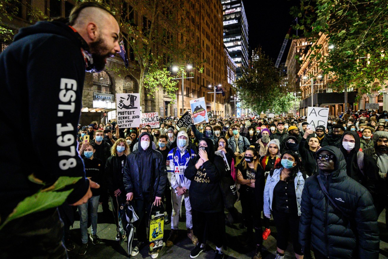 Protesters marching during a Black Lives Matter protest in Sydney on Tuesday night, following the US death of George Floyd.  