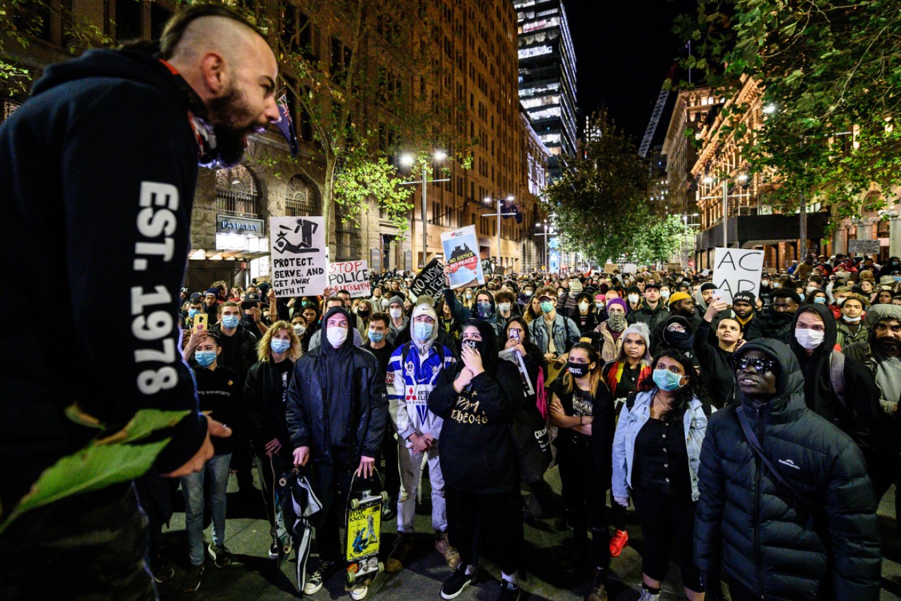Protesters marching during a Black Lives Matter protest in Sydney on Tuesday night, following the US death of George Floyd.