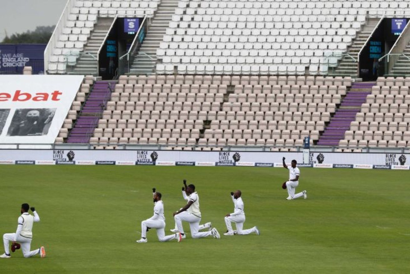 Players took a knee and raised a fist in solidarity with the Black Lives Matter movement.