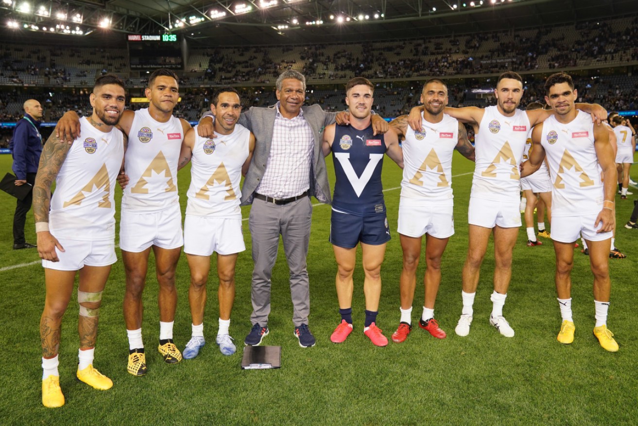 AFL indigenous players pose together with Gilbert McAdam during the Charity State of Origin for Bushfire Relief match between Victoria and All Stars at Marvel Stadium earlier this year. 