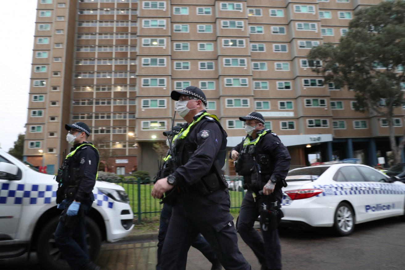 Victoria Police at one of the locked down towers in inner-Melbourne in July.