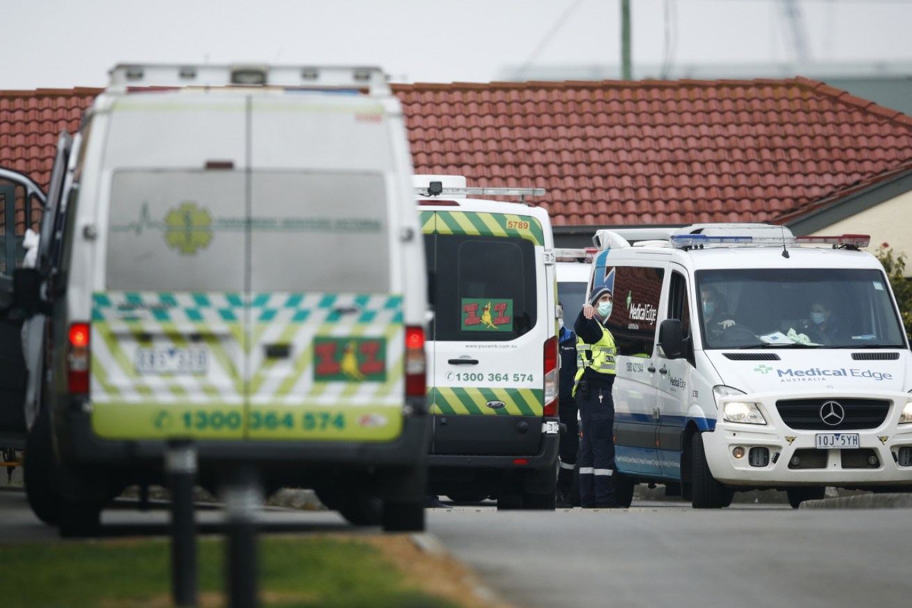 Ambulances and medical staff at St Basil's in Melbourne on Monday. 