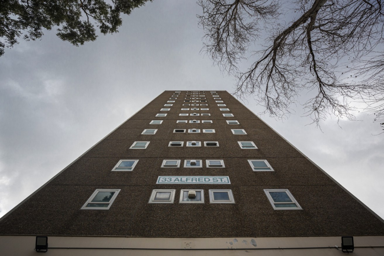 A hard lockdown remains at the public housing tower at 33 Alfred Street, North Melbourne, on Sunday.