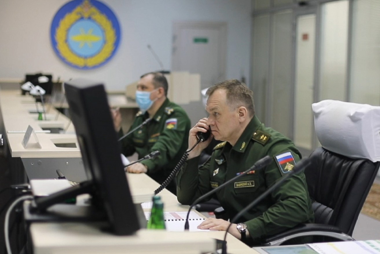 Servicemen of the Russian Aerospace Forces seen at the mission control center of the Plesetsk Cosmodrome.