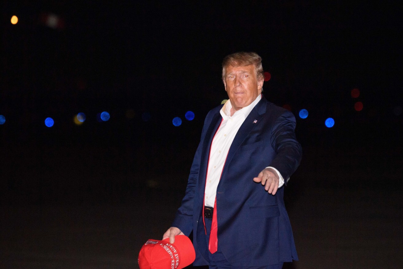 US President Donald Trump steps off Air Force One after returning from a rally in Tulsa, Oklahoma.