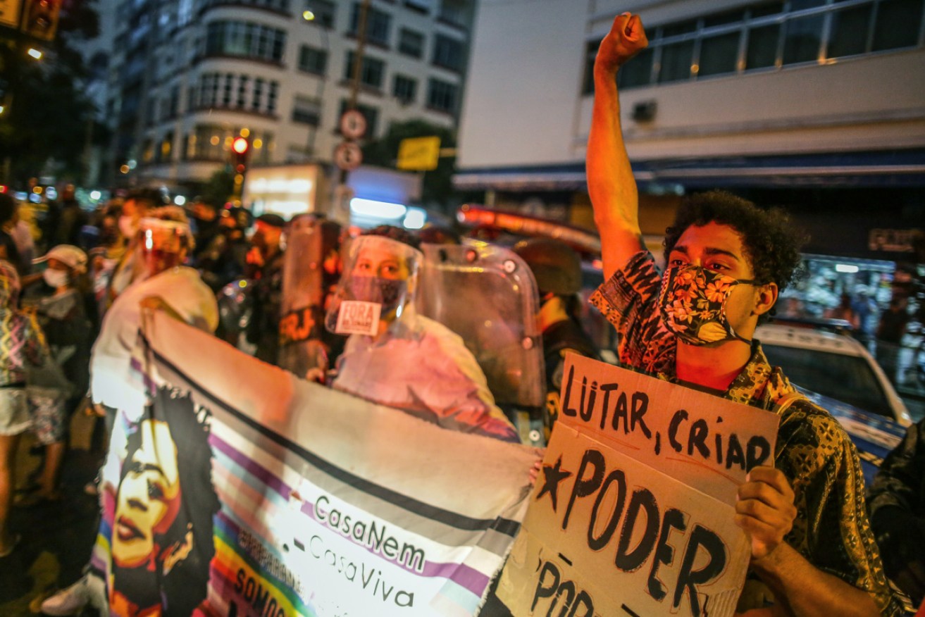 Demonstrators rally against far-right President Jair Bolsonaro <i> Photo: Getty</i>