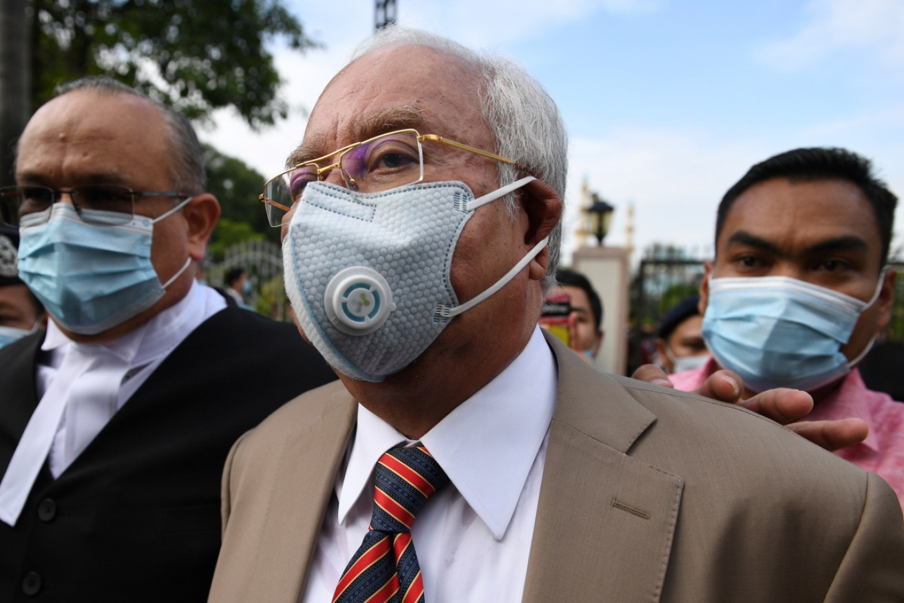 Malaysia's former prime minister Najib Razak arrives at court for the verdict.