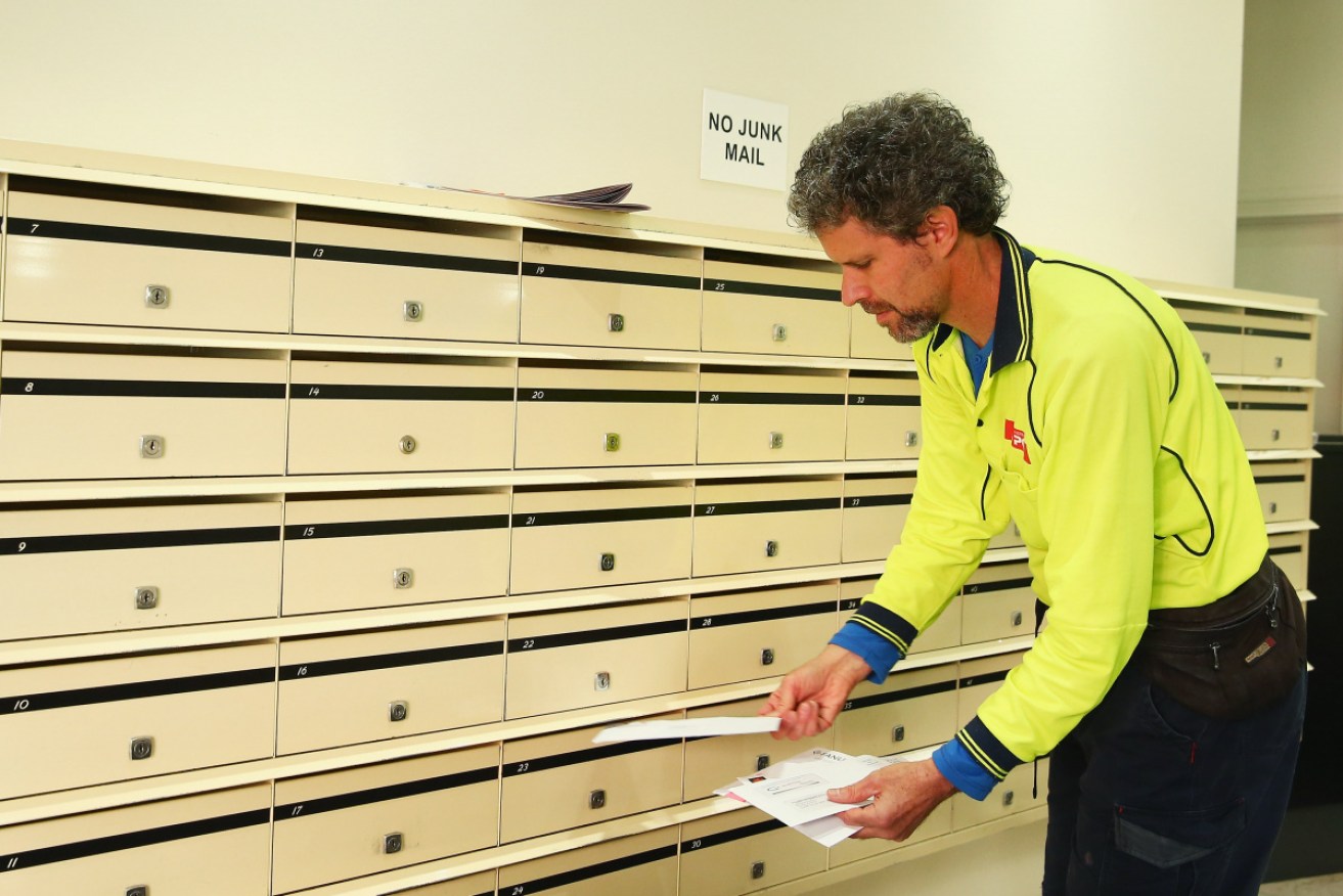Australia Post workers have have struck a deal to guarantee jobs and pay ahead of cuts to letter delivery services. 