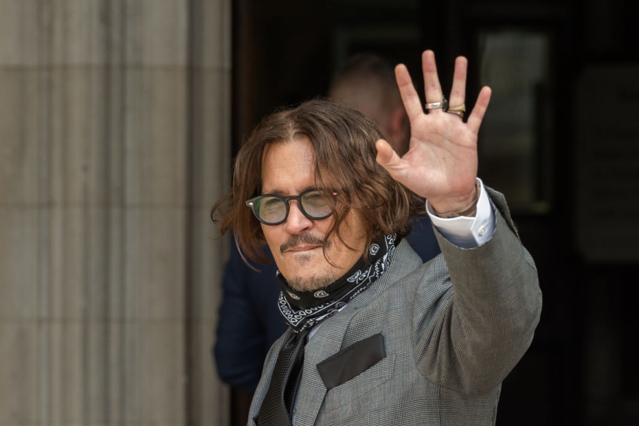 Johnny Depp arrives at court in London during his case against <i>The Sun</i>.