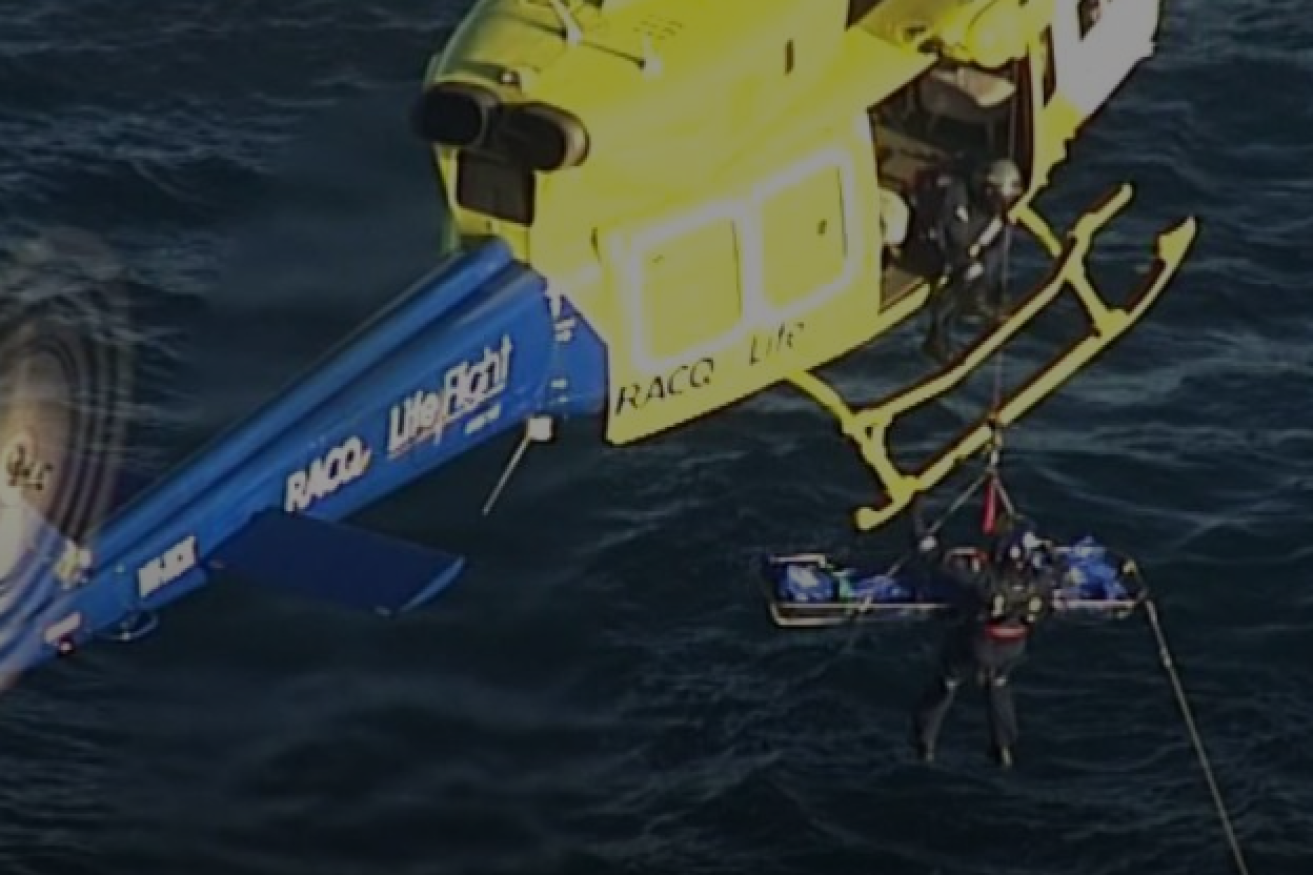 The fatally injured diver is lifted into the rescue helicopter.