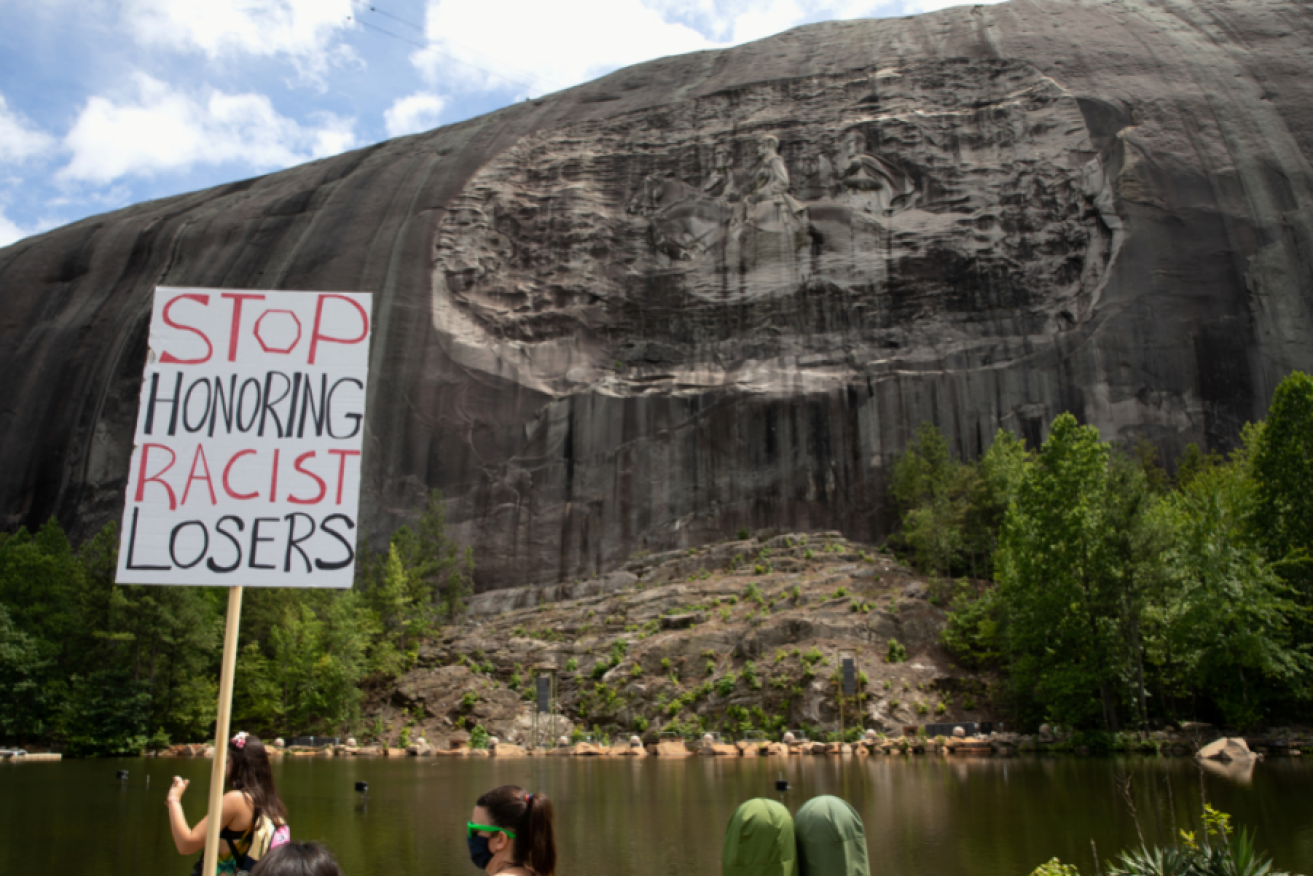 The march against the evils of slavery, honoured on Georgia's Stone Mountain, attracted an armed and determined crowd.