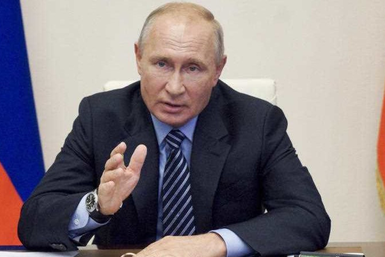 Vladimir Putin has used an economic forum to chastise the US.