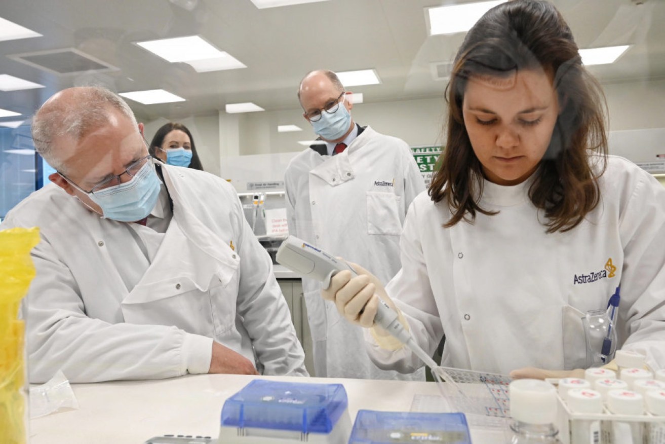 Scott Morrison is briefed on the AstraZeneca vaccine during an August visit to the pharma outfit's Sydney lab.