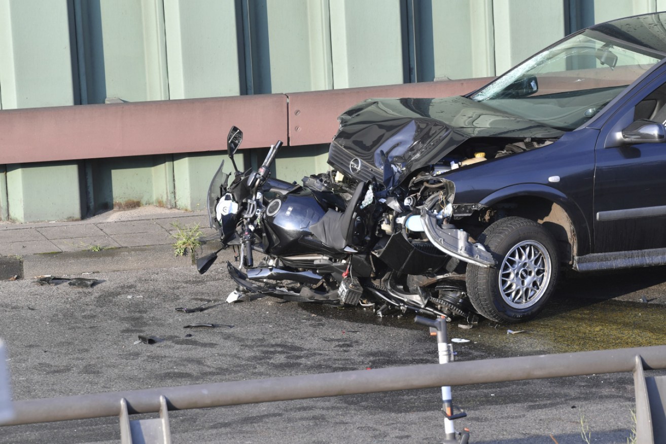 A car and a motorcycle stand on the city motorway A100 after an accident in Berlin, Germany.