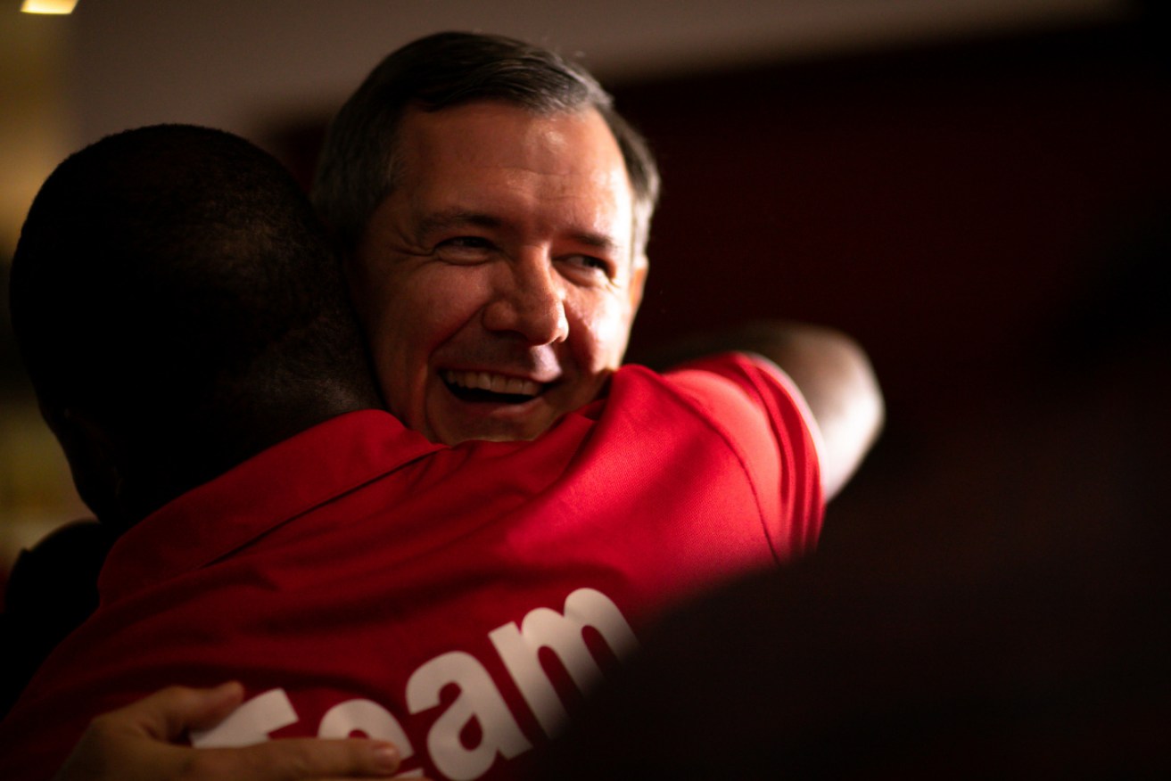 Labor's Michael Gunner, celebrating on Saturday, looks set to remain the NT's chief minister. 